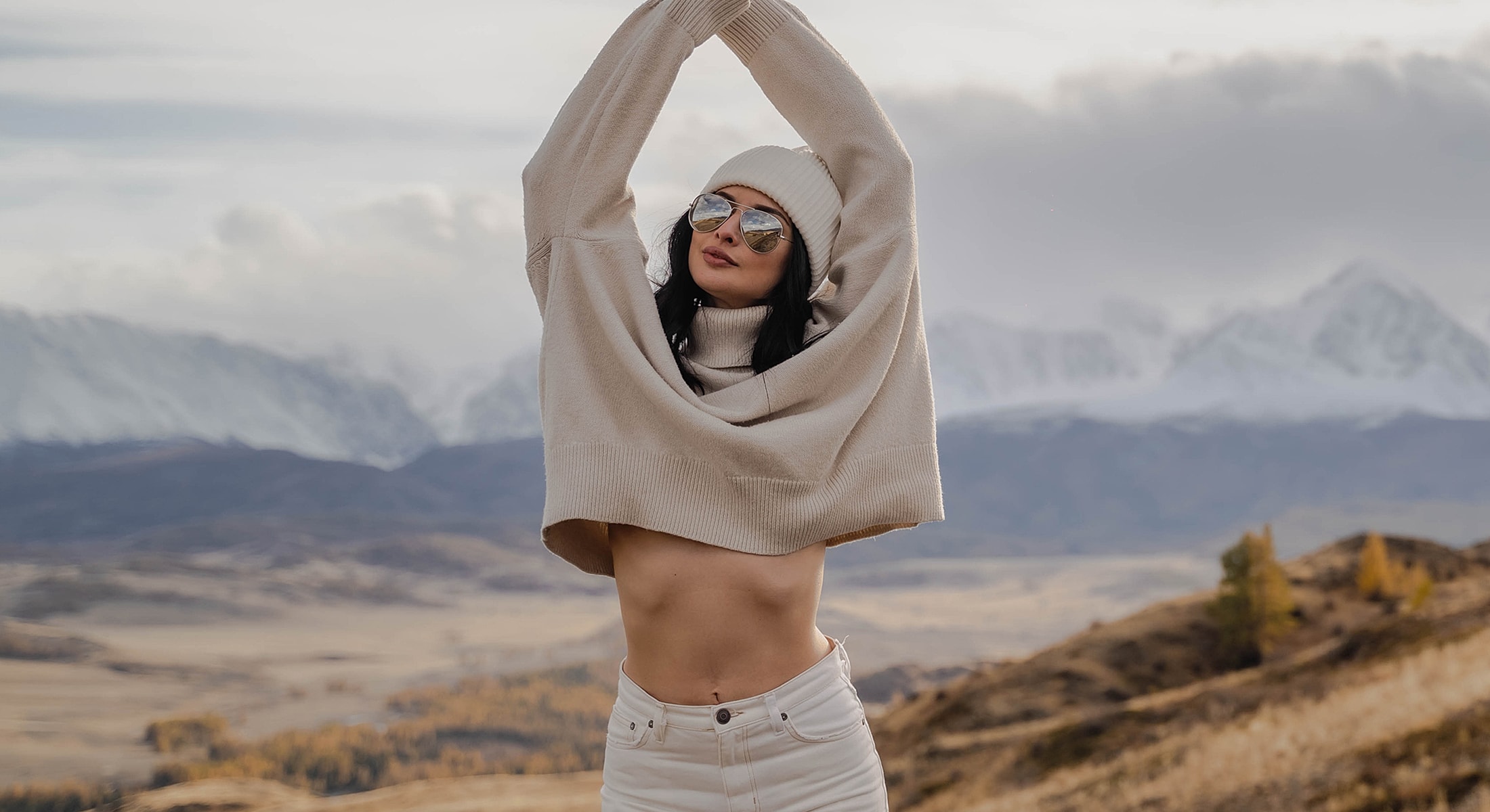 Wasilla Non-Surgical Mommy Makeover model in stylish outfit posing outdoors.